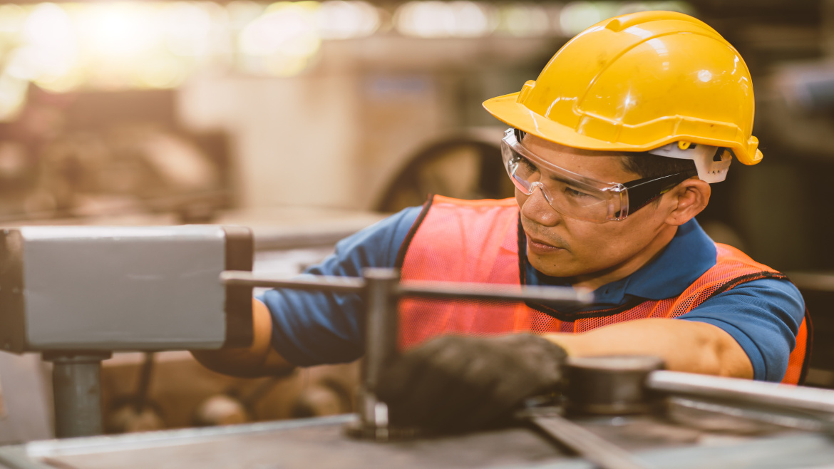 Worker in refrigerated food facility.