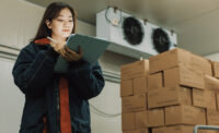 Woman monitoring warehouse